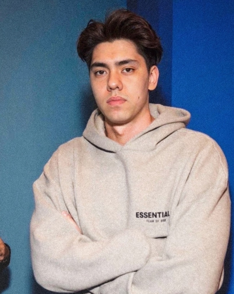 Matthew Stevens in a grey hoodie, black and white portrait